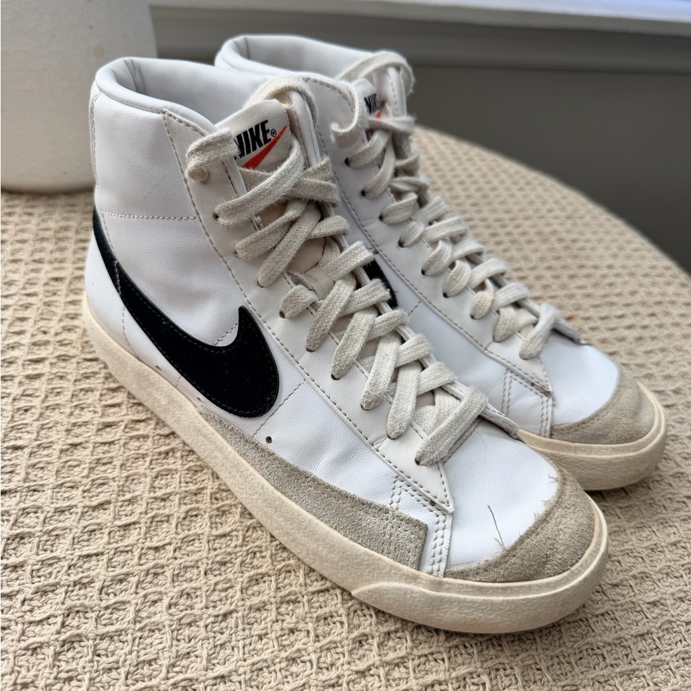 Nike White High-Top Sneakers with Black Swoosh